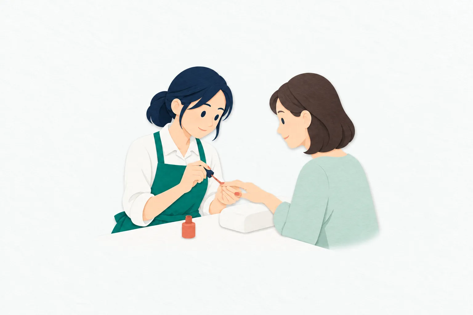 女性のネイリストが、クッションに置かれたお客さんの指を支えながら、小さな筆で爪に色を塗っている。